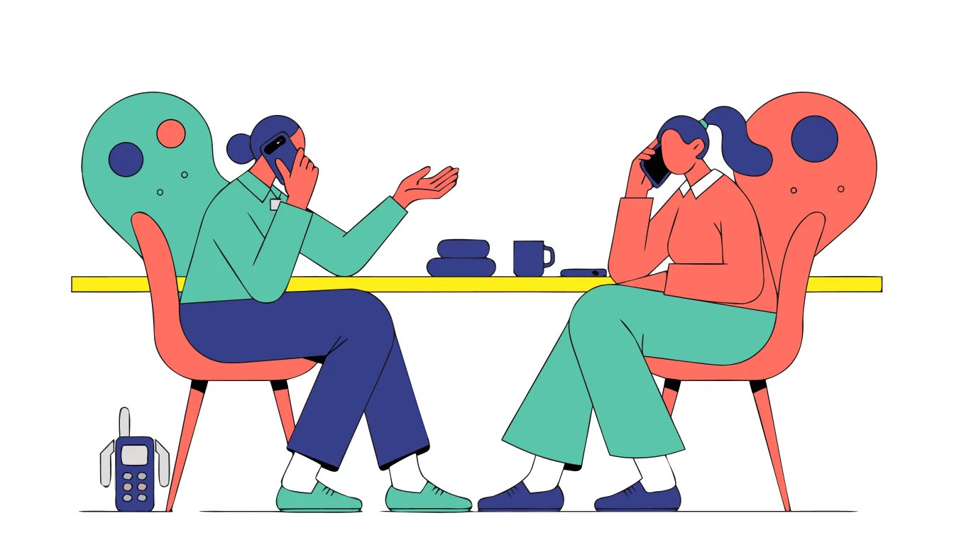 An employee using a trusted second device to seek workplace privacy support while a managed phone remains aside.